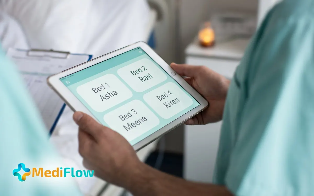 A nurse at a ward desk looking at a bed board on a screen.